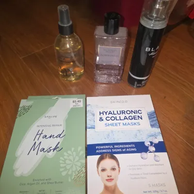 Sale Photo Thumbnail #46: An assortment of bath, body, and skincare products. Includes a Victoria's Secret Bombshell Fine Fragrance Mist, a Vanilla hair & body mist, a Kenneth Cole Black body spray, Spa Life Intensive Repair Hand Masks, and SKIN 2.0 Hyaluronic & Collagen Sheet Mas