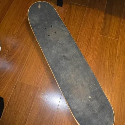 Sale Photo Thumbnail #188: Complete Element skateboard featuring classic 'Wind Water Fire Earth' deck graphics and Element logo. Fitted with metal trucks and white skate wheels. Shows signs of wear including scuffs, scratches on the deck bottom, and worn grip tape on top, consisten