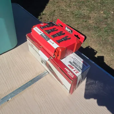 Sale Photo Thumbnail #146: Hyper Tough 2.1-Amp corded oscillating multitool in original box, paired with a Milwaukee multi-tool blade set accessory pack. Items appear to be in open-box condition; contents not fully verified inside boxes.