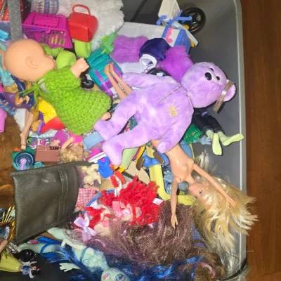 Sale Photo Thumbnail #56: A large collection of assorted toys and accessories contained in a tub. Items include fashion dolls (Barbie style, Monster High style, and Aladdin character), Ty Beanie Babies plush animals (pink Sakura bear and purple princess bear), a pink Barbie RC Mon