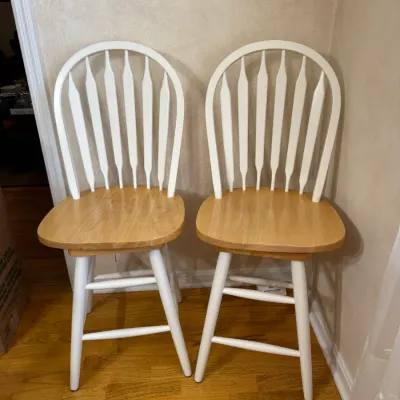 Sale Photo Thumbnail #166: Pair of two-tone Windsor-style swivel barstools featuring white painted frames and natural wood seats.