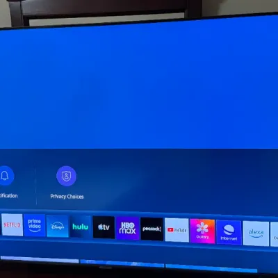 Sale Photo Thumbnail #125: Modern Samsung flat-screen Smart TV powered on, displaying the home screen menu.