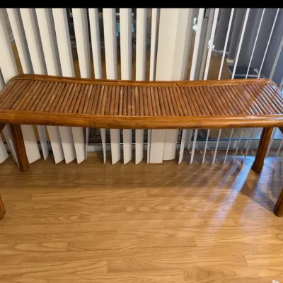 Sale Photo Thumbnail #412: Vintage rattan and bamboo waterfall bench with a slatted top and warm glossy finish, mid-20th century.
