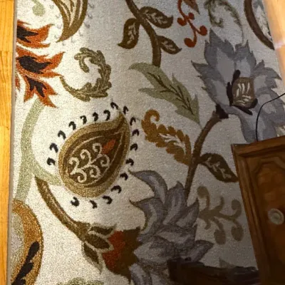 Sale Photo Thumbnail #62: Contemporary hand-tufted wool area rug featuring a oversized floral and paisley botanical pattern in muted shades of blue, olive green, rust, and gold on a beige background.