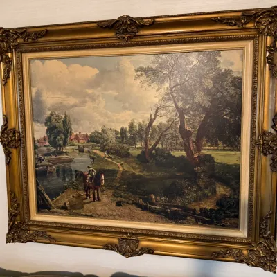 Sale Photo Thumbnail #84: Framed print reproduction of John Constable's "The White Horse" housed in an ornate gilded baroque-style frame.