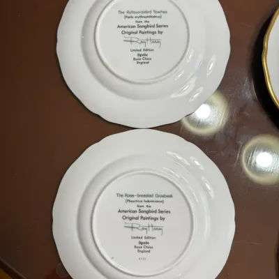 Sale Photo Thumbnail #206: Underside of two Spode bone china collector plates from the American Songbird Series featuring artwork by Ray Harm.