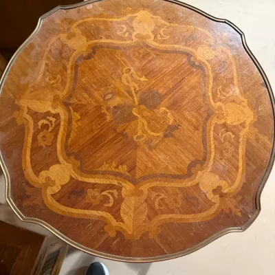 Sale Photo Thumbnail #387: Vintage Italian marquetry inlay side table with floral and musical instrument motifs on a scalloped wood tabletop.