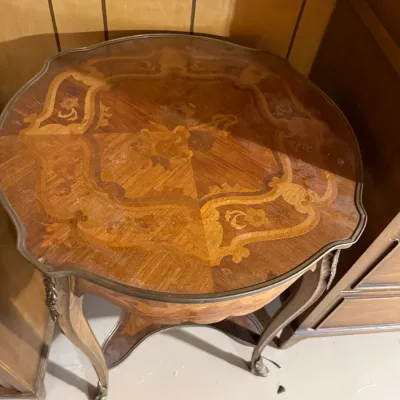 Sale Photo Thumbnail #384: Vintage French Provincial style accent table with intricate wood marquetry inlay and brass claw feet.