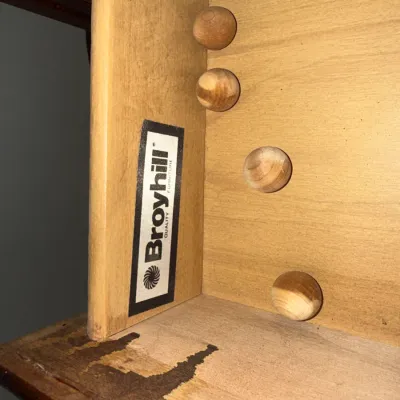 Sale Photo Thumbnail #113: Interior drawer detail showing an authentic Broyhill Quality Furniture maker's mark and wooden construction.