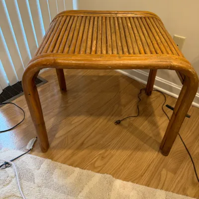 Sale Photo Thumbnail #140: Vintage bentwood bamboo side table featuring a slatted reed top and a waterfall frame design.