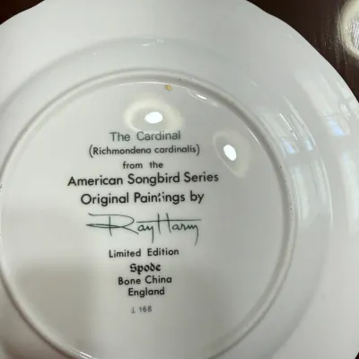Sale Photo Thumbnail #208: Underside maker's mark on a Spode bone china collector plate from the American Songbird Series featuring artwork by Ray Harm.