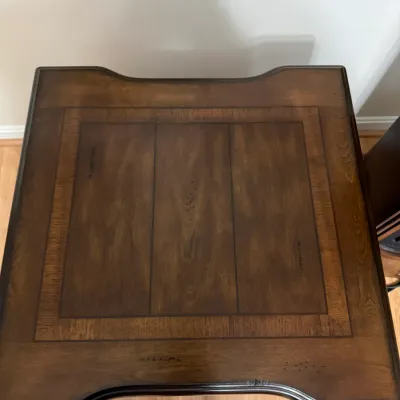 Sale Photo Thumbnail #17: Top view of a traditional dark wood accent table featuring a framed inlay design and molded edges.