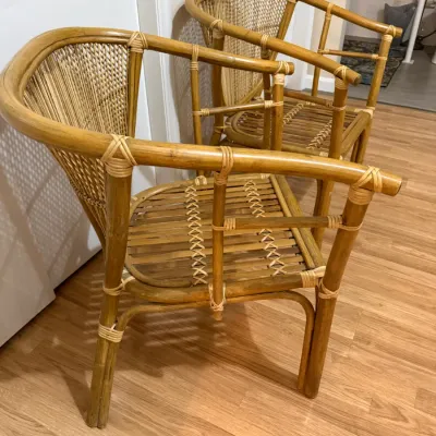 Sale Photo Thumbnail #134: Pair of vintage bamboo and rattan barrel armchairs with woven backs and slatted seats.