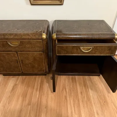 Sale Photo Thumbnail #106: Pair of vintage burl wood nightstands or campaign-style cabinets featuring brass inlay trim, corner accents, and half-moon drawer pulls.