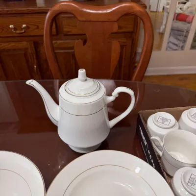 Sale Photo Thumbnail #304: Royal Majestic fine china coffee pot with matching teacups and plates featuring gold trim.