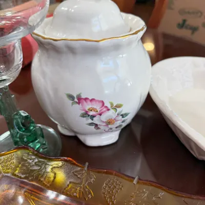 Sale Photo Thumbnail #199: Vintage white porcelain covered sugar bowl featuring a wild rose floral pattern and gold trim on the rim.