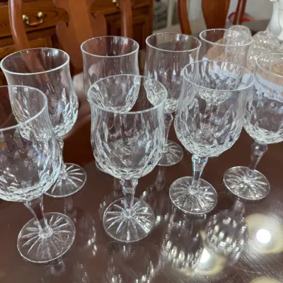 Sale Photo Thumbnail #309: Set of seven vintage crystal wine glasses featuring a diamond-cut bowl pattern and starburst bases.