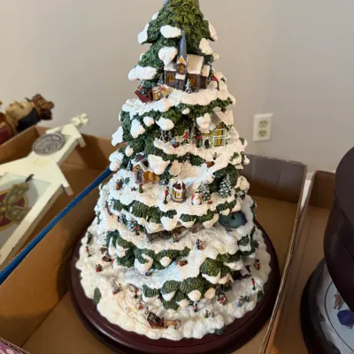 Sale Photo Thumbnail #351: Hawthorne Village animated Christmas tree figurine featuring detailed miniature snowy scenes, small houses, figures, and a clear star topper.