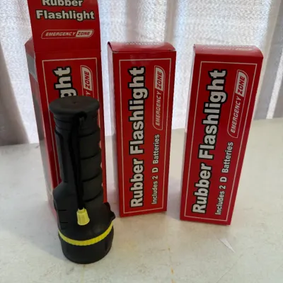 Sale Photo Thumbnail #188: Set of three Emergency Zone rubber flashlights in original red boxes, including one black flashlight with yellow accents unpackaged.