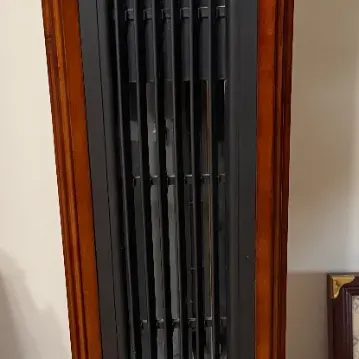 Sale Photo Thumbnail #21: Modern tower space heater featuring a wood-tone cabinet finish and digital display panel.