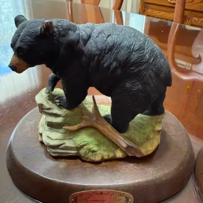 Sale Photo Thumbnail #248: Painted resin black bear figurine mounted on an oval wooden display base with brass nameplate.