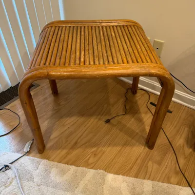 Sale Photo Thumbnail #141: Vintage bent rattan and bamboo waterfall side table, featuring a ribbed top and a warm honey finish with light surface wear.