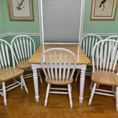 Sale Photo Thumbnail #167: Two-tone country dining set featuring a natural wood top table and six white spindle-back chairs with matching natural wood seats.