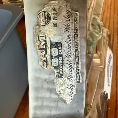 Sale Photo Thumbnail #327: Vintage Regal China Jim Beam bourbon whiskey decanter showing a worn, original paper label.