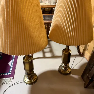 Sale Photo Thumbnail #407: Pair of vintage brass table lamps featuring turned column bases and beige pleated fabric shades.