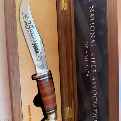Sale Photo Thumbnail #187: Commemorative Case XX fixed-blade knife celebrating 25 Years of Friends of NRA (1992–2017), housed in a fitted wooden presentation display box.