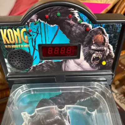 Sale Photo Thumbnail #404: Vintage Kong: The 8th Wonder of the World tabletop pinball game featuring a digital score display and arcade graphics, circa 2005.