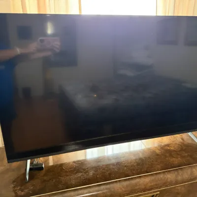 Sale Photo Thumbnail #97: Vizio flat-screen smart television on metallic legs, resting atop a wood credenza.