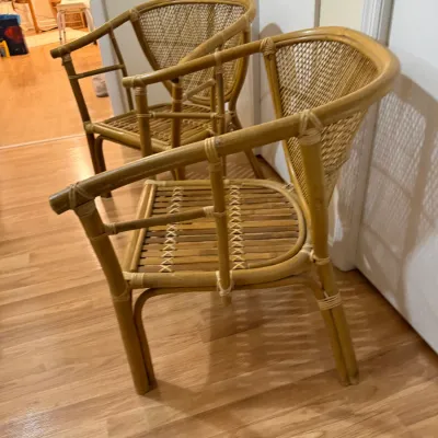 Sale Photo Thumbnail #135: Pair of vintage bamboo and rattan barrel armchairs with woven backs and slat seats.