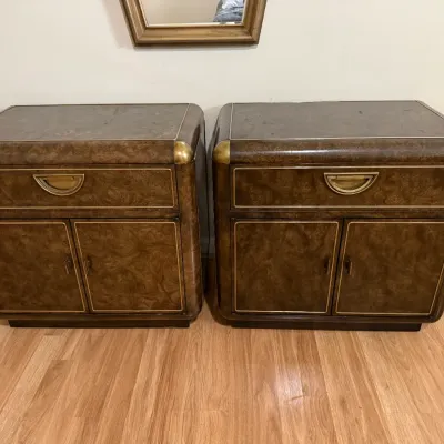 Sale Photo Thumbnail #105: Pair of Hollywood Regency burl wood nightstands featuring brass corner accents and half-moon drawer pulls.