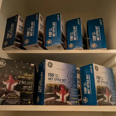 Collection of GE vintage 150 clear net style outdoor light sets in original boxes.