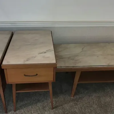 Mid-century modern three-piece wooden living room table set with faux-marble laminate tops, including two matching end tables with...