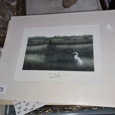 Matted art print depicting a white egret in a marshy landscape, hand-signed by the artist along the lower margin.