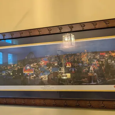 Framed panoramic print titled "The Last Ride" featuring the Myrtle Beach Pavilion Amusement Park at night, housed in a carved...