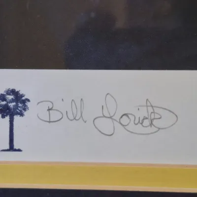 Hand-signed Bill Lorick art print detail, featuring a South Carolina palmetto tree and crescent moon emblem.