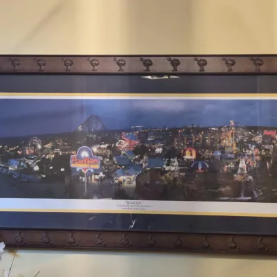 Framed panoramic print titled "The Last Ride," depicting the Myrtle Beach Pavilion Amusement Park at night in a carved wooden...