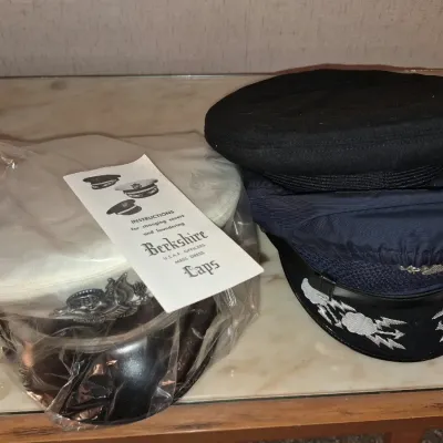 U.S. Air Force officer service caps, including a Berkshire mess dress hat in original plastic packaging with instruction sheet and...