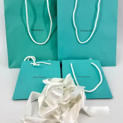 Sale Photo Thumbnail #70: lot 70: Tiffany & Co gift bags