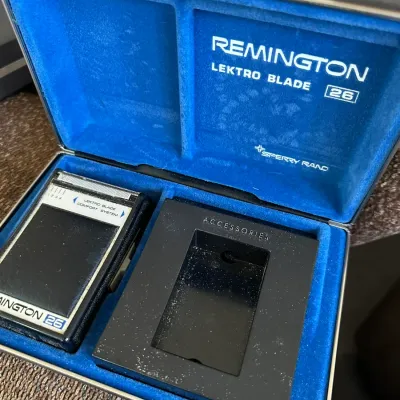 Sale Photo Thumbnail #620: Vintage Remington Lektro Blade 26 electric shaver by Sperry Rand in original blue velvet-lined hard storage case.