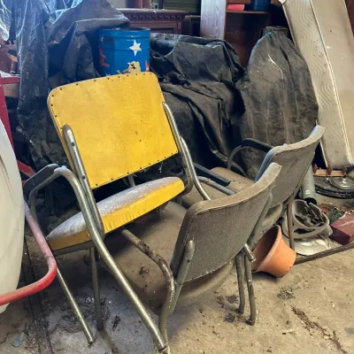 Sale Photo Thumbnail #554: Vintage metal folding chairs with vinyl upholstery, showing heavy wear and dust from storage.