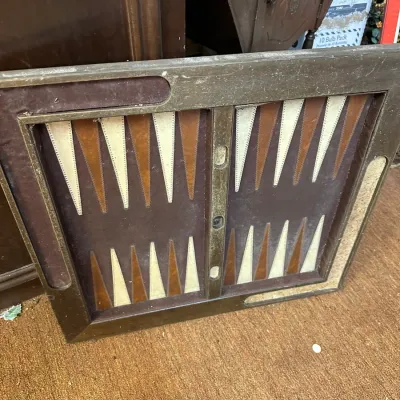 Sale Photo Thumbnail #38: Vintage leather-bound backgammon game board showing moderate wear and dust.