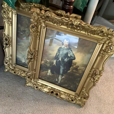 Sale Photo Thumbnail #650: Pair of vintage framed art prints featuring Gainsborough's 'The Blue Boy' and Lawrence's 'Pinkie' in ornate giltwood frames.