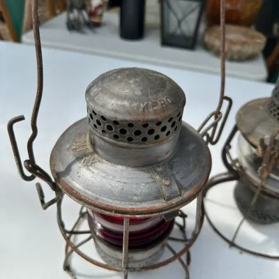 Sale Photo Thumbnail #163: Vintage Missouri Pacific Lines Adams & Westlake Kero railroad lantern with a wire guard and red glass globe.