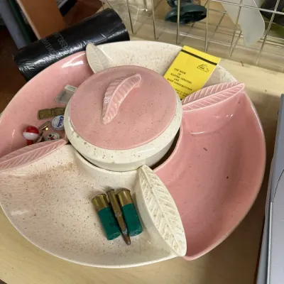 Sale Photo Thumbnail #10: Vintage mid-century pink and cream speckled melamine lazy Susan server with leaf handles, containing assorted small household items.