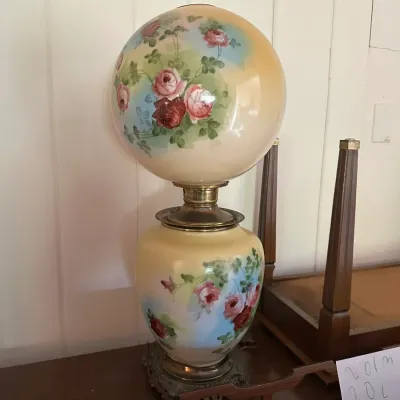 Sale Photo Thumbnail #200: Antique Gone With the Wind style parlor lamp with hand-painted floral glass globe and base on a brass footed mount.