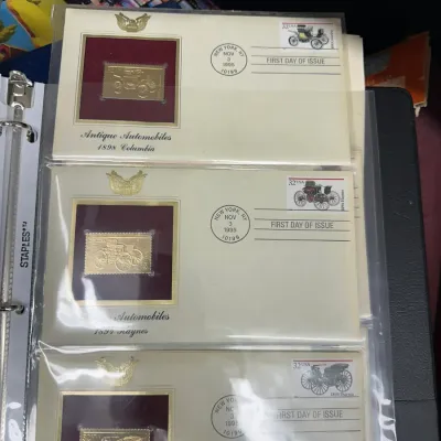 Sale Photo Thumbnail #98: Collection of three 1995 Antique Automobiles First Day Covers featuring gold replica stamps in plastic binder sleeves.